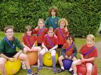 Good sports brave late-afternoon rain