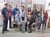 Plumbing kids rest up on copper chairs after move