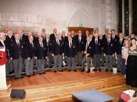 Launceston Male Voice Choir perform at the Great Hall in Dartington to launch the 2016 Poppy Appeal