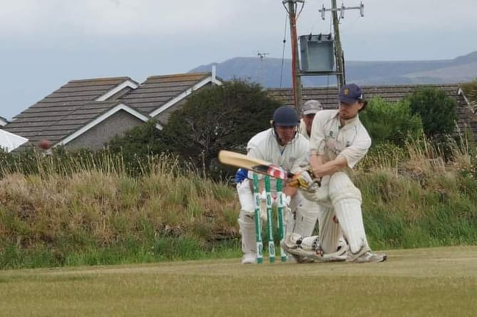 Tintagel's Tom Parsons sweeps during Saturday's eight-wicket victory over South Petherwin at Butts Field on Saturday