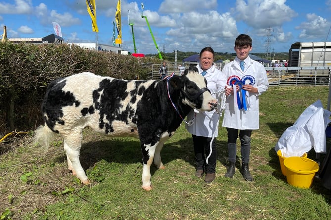Julie and Dylan Brooks with their champion British Blue from Dymond Blue Herd