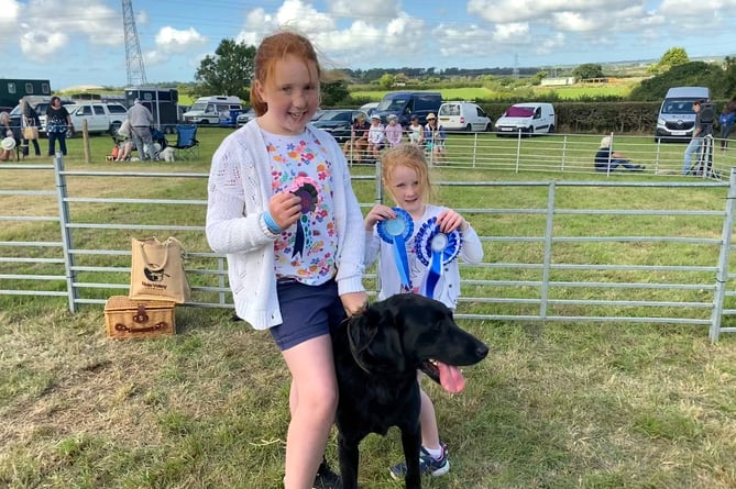 Grace and Lauren Cann of Boyton were sharing the responsibility of showing their family dog, black Labrador Monty. Between them they had a good haul of rosettes and Lauren was especially pleased to have won the Young Handler class, later going on to collect the Reserve Champion ribbon