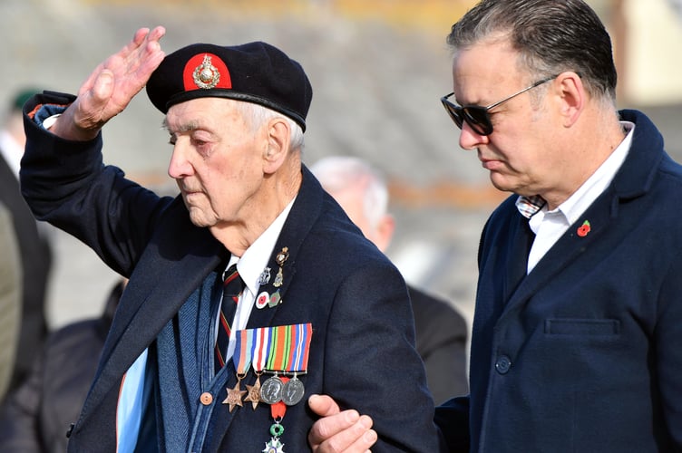 Taking the Salute is Alan Litchfield President of The Royal British Legion Bude along with Ian Coe