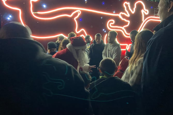 Santa greets the young children who patiently waited for him to arrive on the GoCornwall bus
