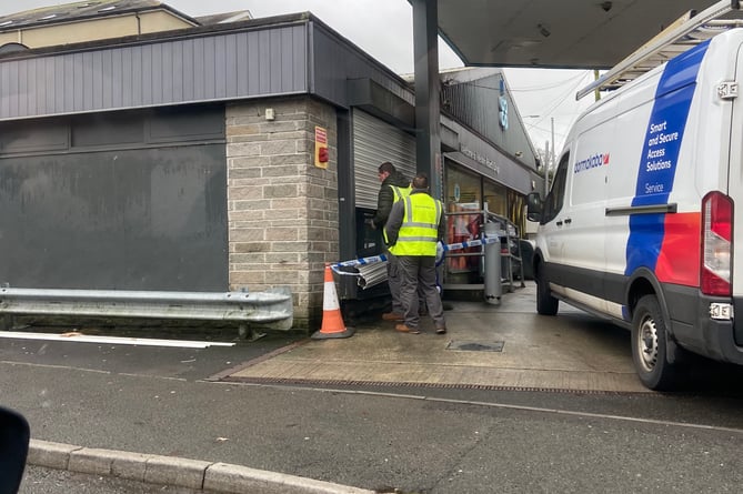 The damage being assessed at the Co-op garage on Woburn Road, Launceston