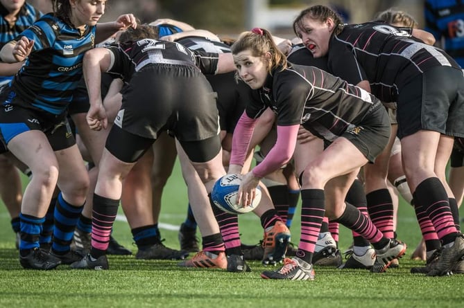 Launceston scrum-half Amy Warman prepares to throw a pass in yesterday's Women's Junior Cup clash at Dings Crusaders.