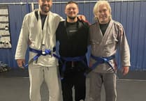 Three members receive blue belts at San Tsuru Academy