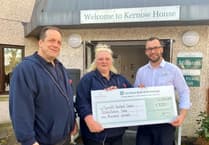 Care home make financial donation to health charity