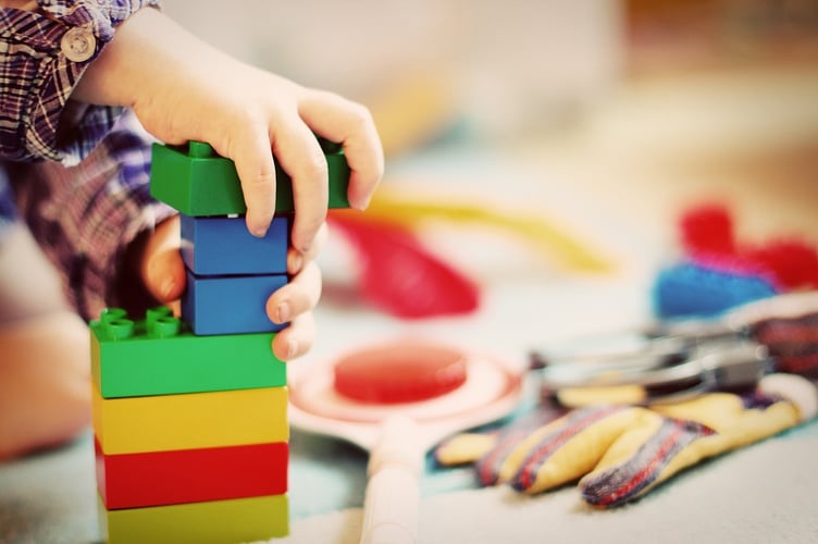 Stock of a child playing with some toy blocks