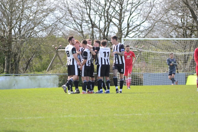 Holsworthy celebrate Ollie Moores' winner against Teignmouth at Upcott Field.