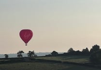 Hot air balloon seen floating over Launceston