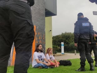 Just Stop Oil protestors cover Falmouth University in orange paint
