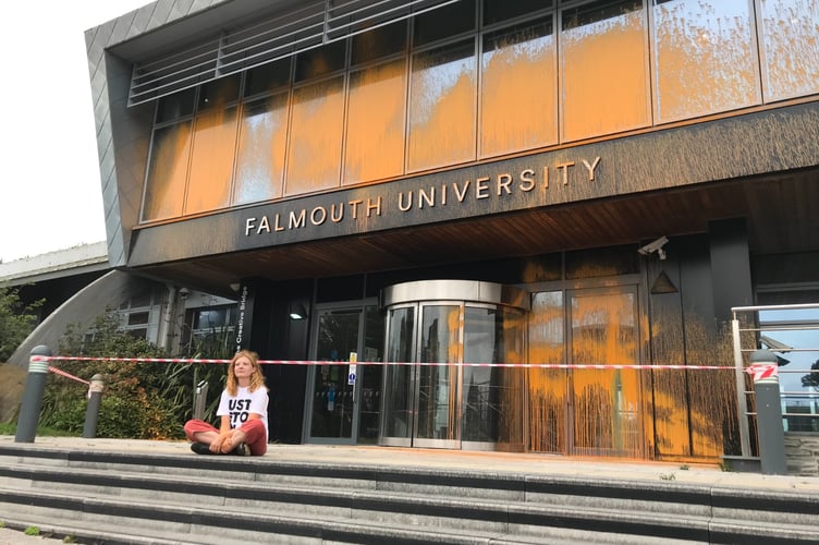 Holly Astle, 28, a Falmouth illustration alumna, used a fire extinguisher to paint the Falmouth Link Building