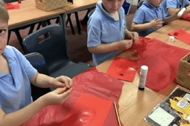 Students made their own poppies for the school’s Remembrance service, along with poppy lanterns 
