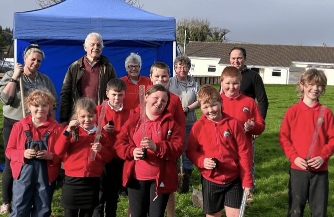 Parents, children and councillors got stuck in planting more than 200 saplings