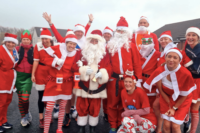 The members of Camelford Up and Running group spread Christmas cheer