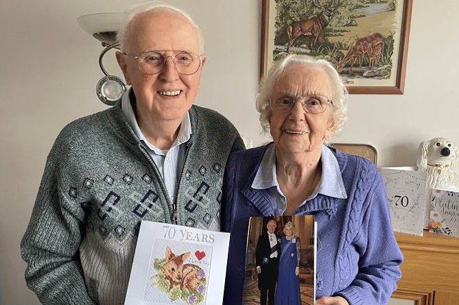 Reg and Hazel Kingsland with their card from the King  on their special day and, inset, on their wedding day 70 years ago.