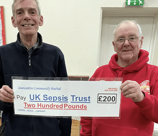 Paul Jellyman (left) presenting Victor Briggs of UK Sepsis Trust with a cheque for £200