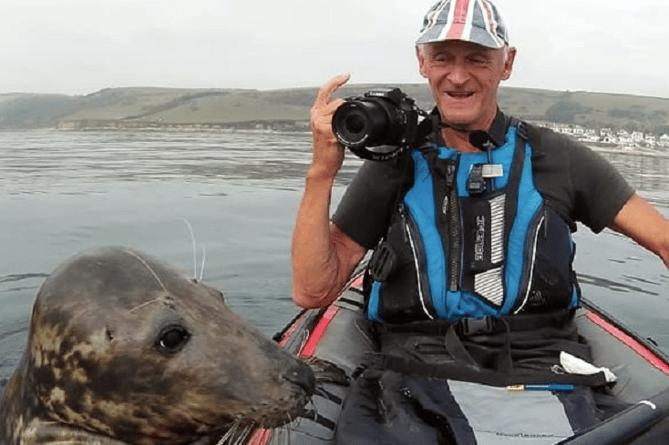 The Lone Kayaker Rupert Kirkwood with Nudger the Cornish grey seal