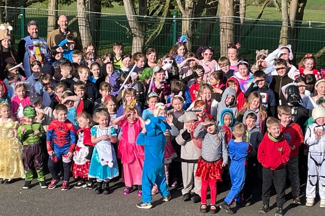 Pupils and staff from Whitstone Primary dressed up in costumes representing characters from the covers of their favourite books for World Book Day