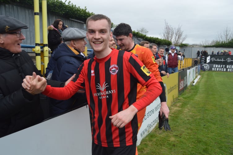 Truro City goalscorer Adam Porter celebrates at full-time.