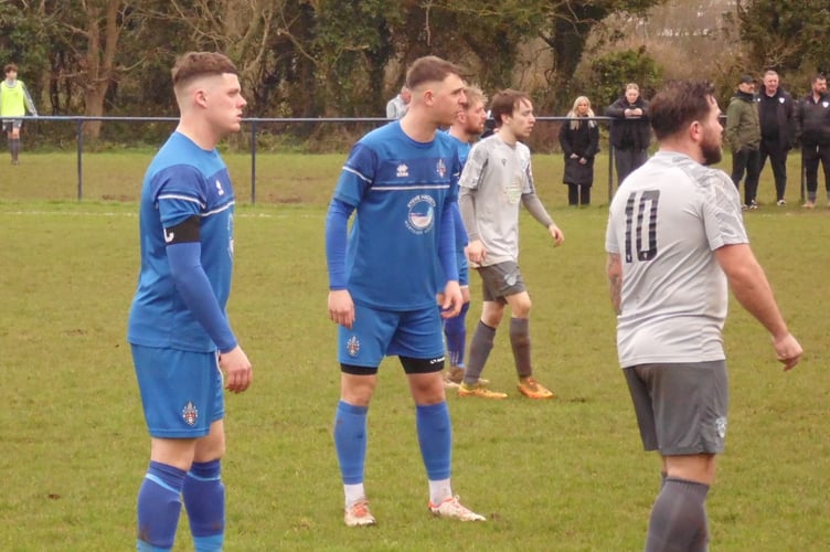 Action from Bude Town (blue) v St Dennis on Saturday at Broadclose Park.