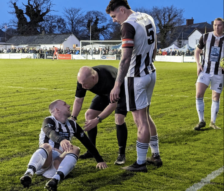 Holsworthy striker Gavin Carter speaks to referee Luke Dennis during last season's SWPL Premier West home clash with Bude Town which was held on Good Friday. Picture: Russell Cox