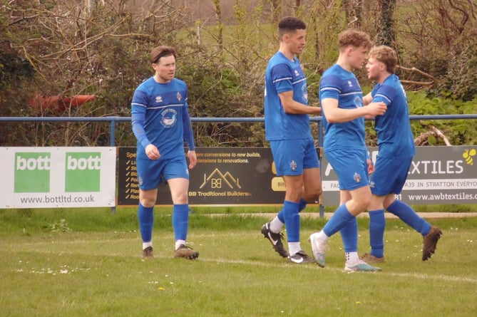 Bude Town celebrate their opening goal against Truro City Reserves on Monday afternoon