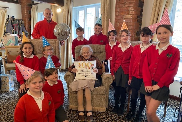 Students visit resident on 100th birthday