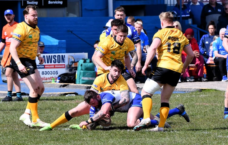 Cornwall's Jake Lloyd tackles Liam McNicholas.