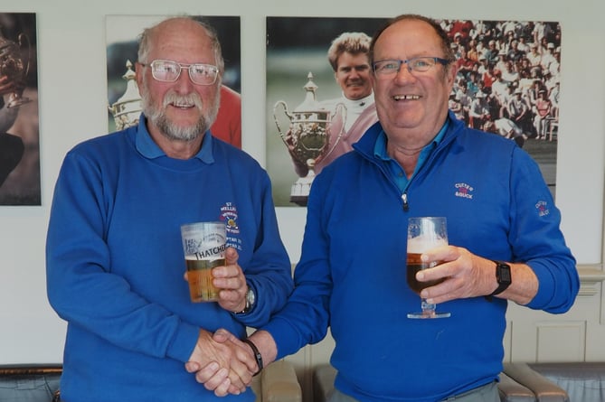 Ian Edwards and Mike Tamblin enjoy a deserved pint after winning the Winter Greensomes competition at St Mellion.