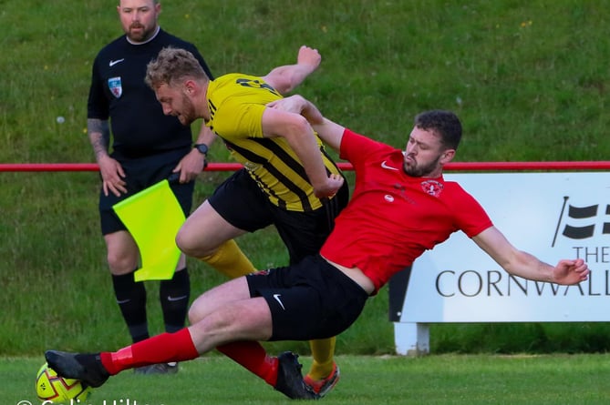 Dobwalls frontman Cam Patterson (yellow) held his nerve in the tenth minute of injury-time at Callington last Thursday night.
