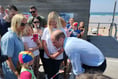 Prince William plays volleyball and meets lifeguards