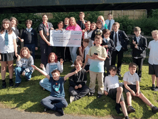 Marathon runner raises thousands for local youth group