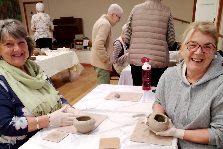 Sue Russell and Angela Smith with the pots they made during the St Giles Women's Guild meeting