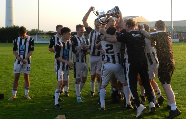 Holsworthy Reserves celebrate winning the Launceston Cup at Pennygillam on Sunday evening.
