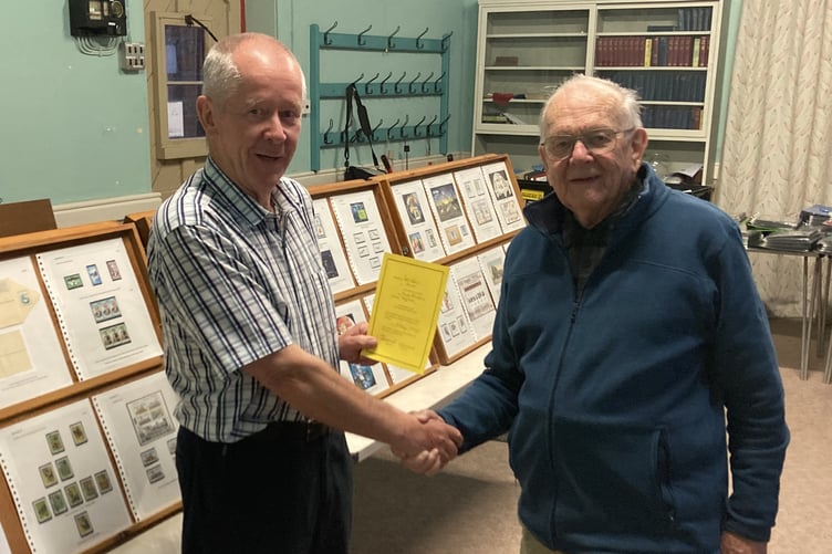 Launceston Stamp Club chairman Viv Sandercock who presented Des Kent with the club’s certificate of appreciation