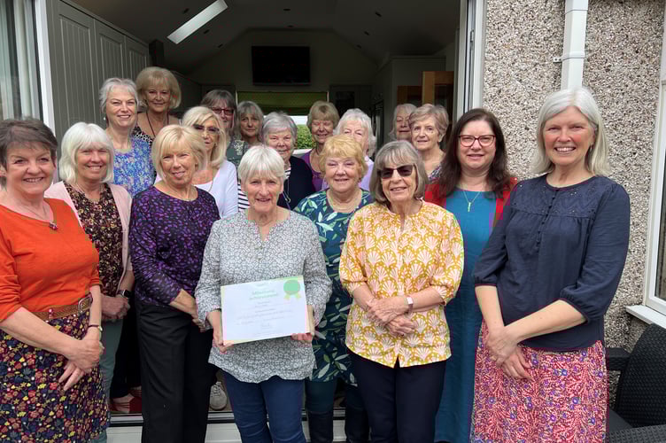 Members of Bude NSPCC presenting Jenny Cloke with her award