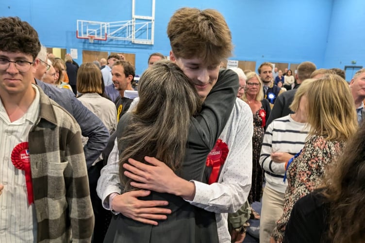 Labour's Jayne Kirkham hugs her son Jude after she won the Truro and Falmouth seat - she said in her acceptance speech she "couldn't have done it without him"