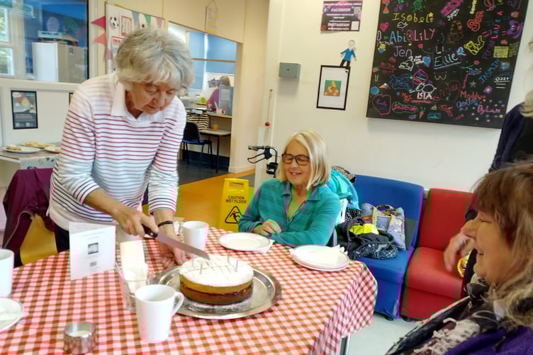 Cutting of the cake for Pam's 90 birthday