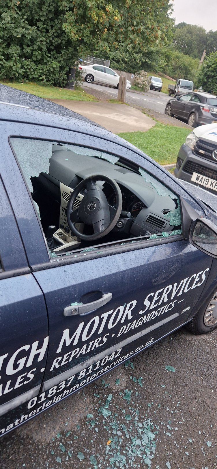 The smashed window of the courtesy car