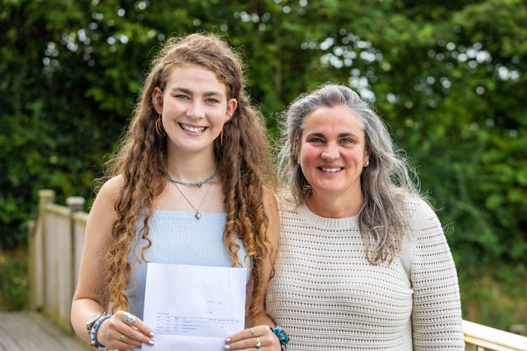 Maddie celebrating her results with her mother