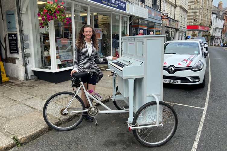 Chloe Marie Aston and her piano bike are making their way through Launceston to perform in the town centre