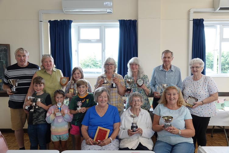 Some of the trophy winners. Back row: Graham Tape, Marlene Bath, Ella-Rae Bath, Mandy Pollard, Sandy Cheshire, Derek Cole, Caroline Tape. Front row: Dylan Bath, Louise Symons, William Westaway, Sue Urwin, Freda Hockin, Alison Butler