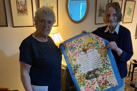 Member, Alison Gribble, (left), won the quiz and was awarded her prize by Alice Brown, (right), herself a long-standing member of the WI
