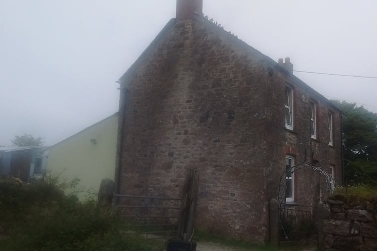The farmhouse on Bodmin Moor the subject of the redevelopment proposals. It would involve the demolition of the rear extension and outbuildings to create the new extension