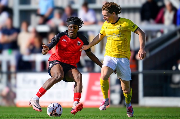 Tavonga Kuleya of Truro City battles for the ball with Alfie Bates of Brackley Town during the Emirates FA Cup 2nd round qualifying tie match between Truro City and Brackley Town at Truro Sports Hub on 14 September 2024  Photo: Phil Mingo/PPAUK