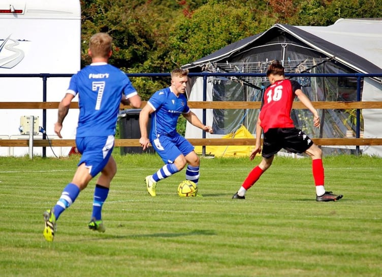 Bude Town's Rocco Dyer, pictured running at the Truro City Reserves defence, was part of the under 18s squad at Holsworthy and will be a big threat at Upcott Field. Pictures supplied by Bude Town AFC
