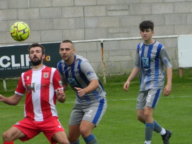Gavin Carter keeps an eye on Newquay's Tom Shepherd as full-back Callum Martyn watches on. Picture: Steve Pearce