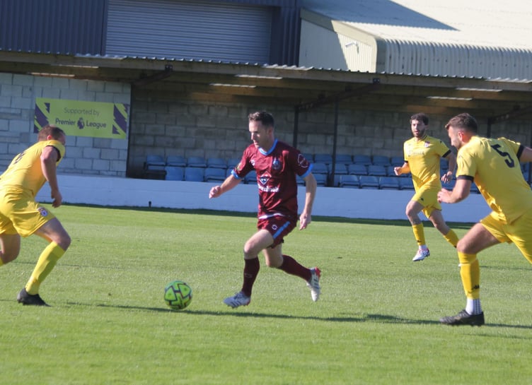 Launceston striker Andy Watkins, who made a goalscoring return to the side, runs at the Bridport defence. Picture: Paul Hamlyn